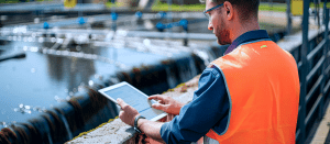 Blogs 13 Environmental Engineer Inspecting Wastewater Treatment Plant with Digital Tablet